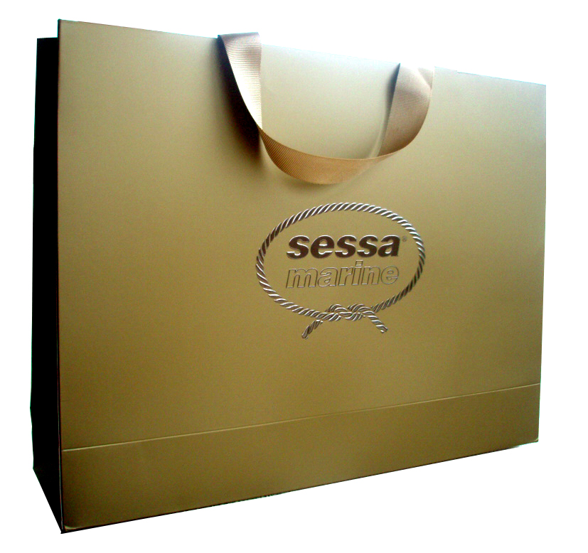 300 gsm Art Paper + Metallic Gold Printing + Matt Lamination + Silver Foil Stamp + Logo Embossing + Ribbon Handle